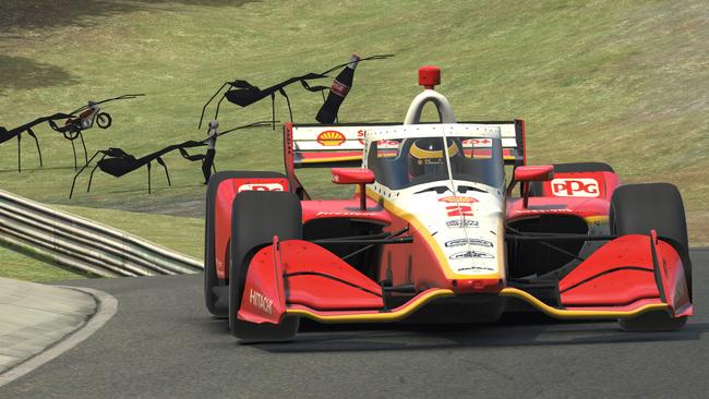 Scott McLaughlin, with some odd virtual spectators in shot as he races in the IndyCar iRacing Challenge Honda Indy Grand Prix of Alabama. Picture: Chris Graythen/Getty Images/AF