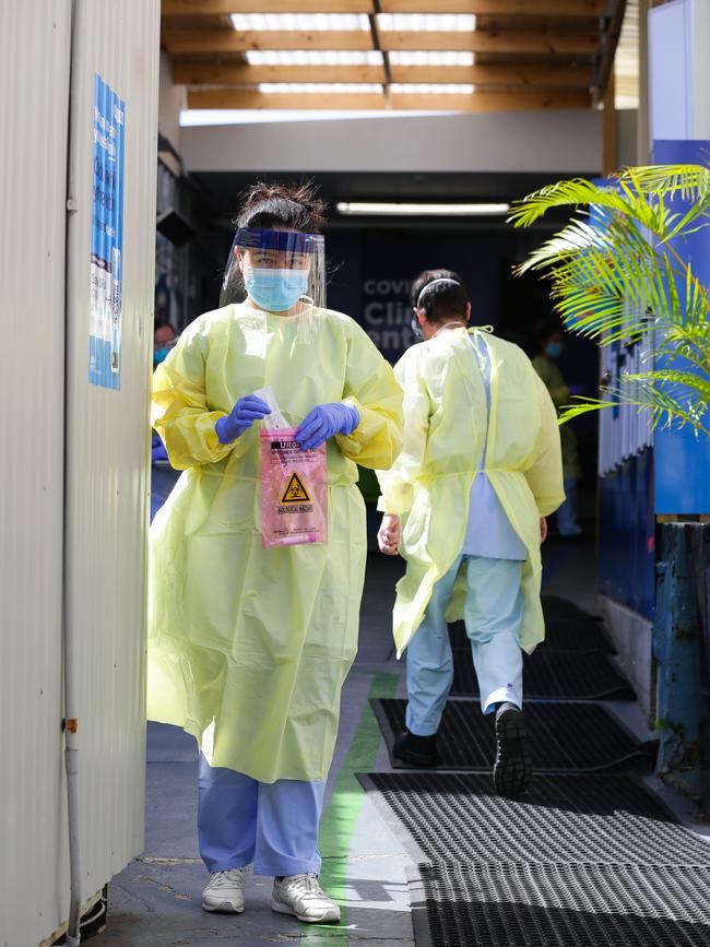 A nurse with a Covid-19 test kit walking through the RPA pop-up clinic. Picture: NCA NewsWire / Gaye Gerard