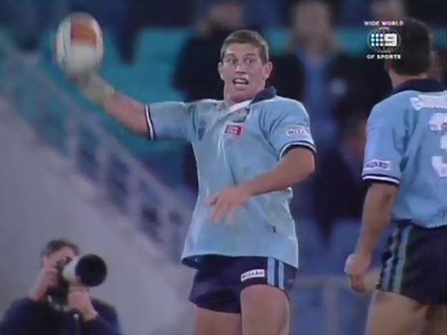 NSW Blues player Brian Fletcher mocks throwing a ball as a hand grenade.