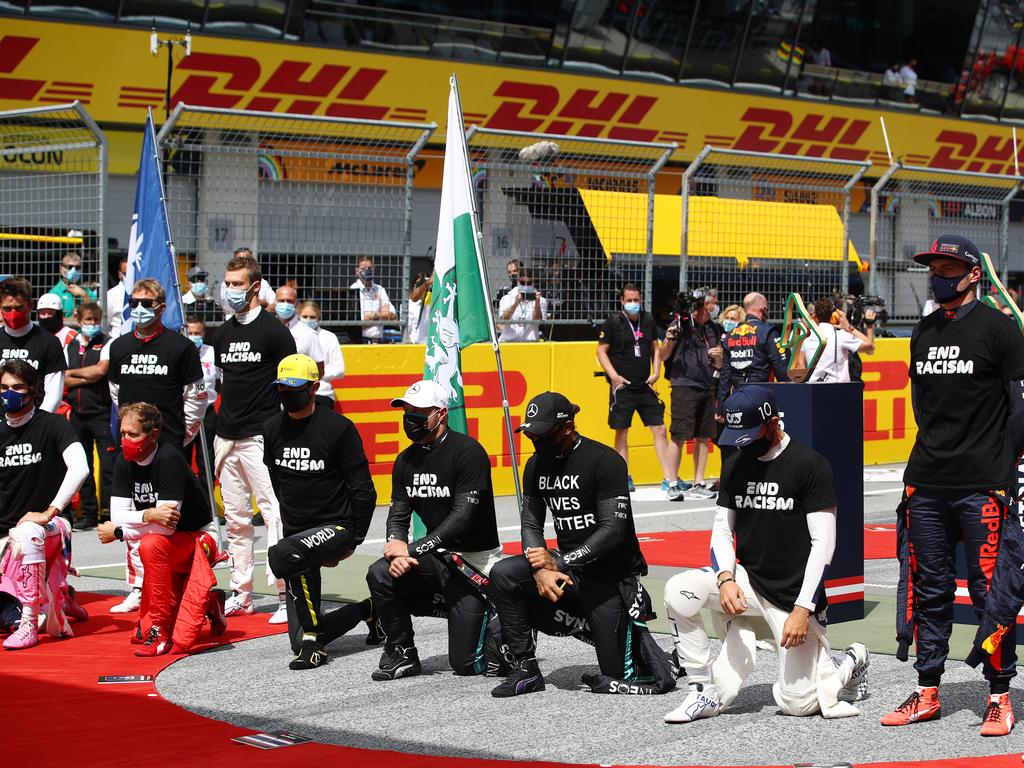 Some drivers take a knee on the grid in support of the Black Lives Matter movement. (Photo by Mark Thompson/Getty Images)