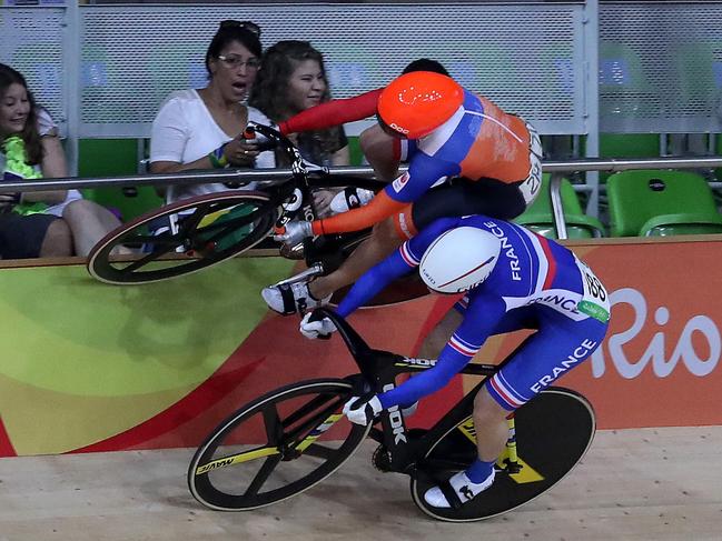 Laurine Van Riessen (214 rides on the wall to avoid Virginie Cueff (188) after Tania Calvo Barbero (no 185) and Olivia Podmore (218) crashed during the Women's Keirin at the Rio Olympics 2016 in the Rio Olympic Velodrome. Pics Adam Head