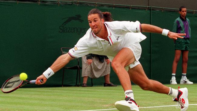 Pat Rafter in action at Wimbledon in 1998. Picture: AP Photo/Alastair Grant