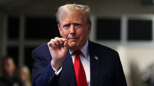 Donald Trump speaks to the press after attending his trial for allegedly covering up hush money payments linked to extramarital affairs, at Manhattan Criminal Court in New York City. Picture: AFP.