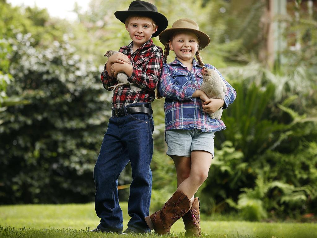 Cousins Lucy Dixon and Robert Jordan with some show chickens they will be entering at this years Royal Easter Show. Picture: Sam Ruttyn