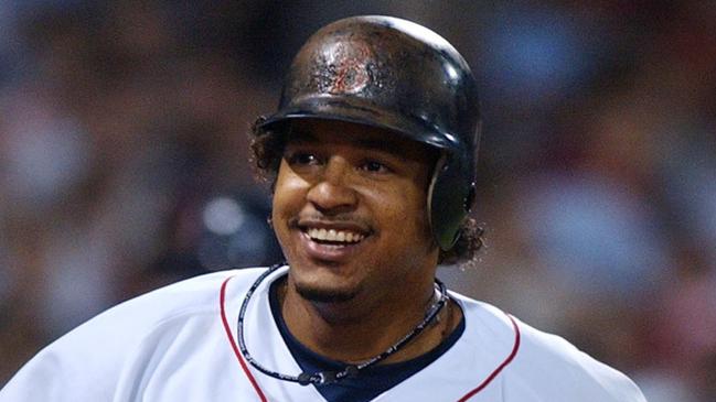 Boston Red Sox' Manny Ramirez smiles as he heads back to the dugout after his home run at Fenway Park in Boston May 21, 2004.  The home run broke a 5-5 tie.  (AP PicCharles/Krupa) sport baseball action o/seas