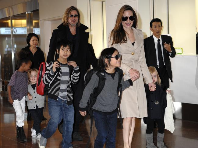 Brangelina and the kids, Maddox, Pax, Zahara, Shiloh, Vivienne and Knox, landed in Japan at Tokyo’s Haneda International Airport. Hundreds of screaming fans waited for hours to catch a glimpse of the Hollywood stars and were delighted to see the whole family arrive. Brad is in Japan to promote his new film, ‘Moneyball.’ Picture: Splash