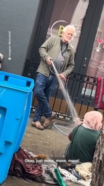 Viral video of man hosing homeless woman sparks outrage