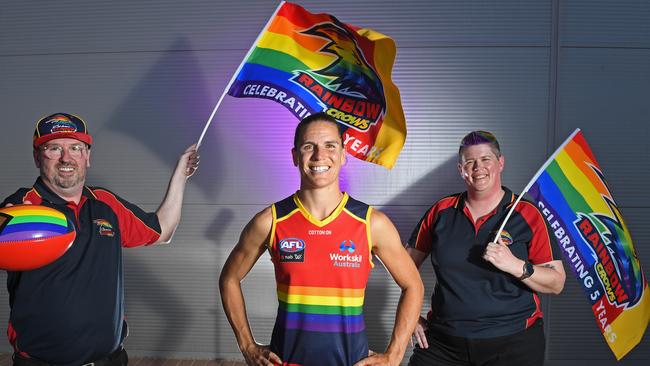 Former Crows captain Chelsea Randall wearing the pride guernsey for the first time in club history in 2021. Pictured with Rainbow Crows supporters Brett McAloney (He/Him) and Megan Harris (They/Them) at West Lakes. Picture: Tom Huntley