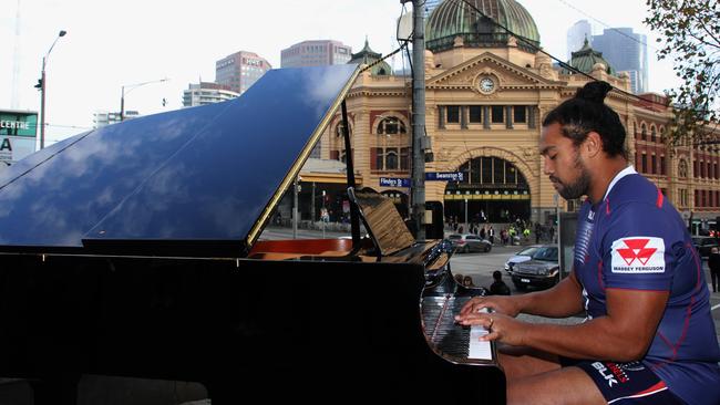 Melbourne Rebels prop Fereti Sa'aga serenades the streets of Melbourne on a grand piano.