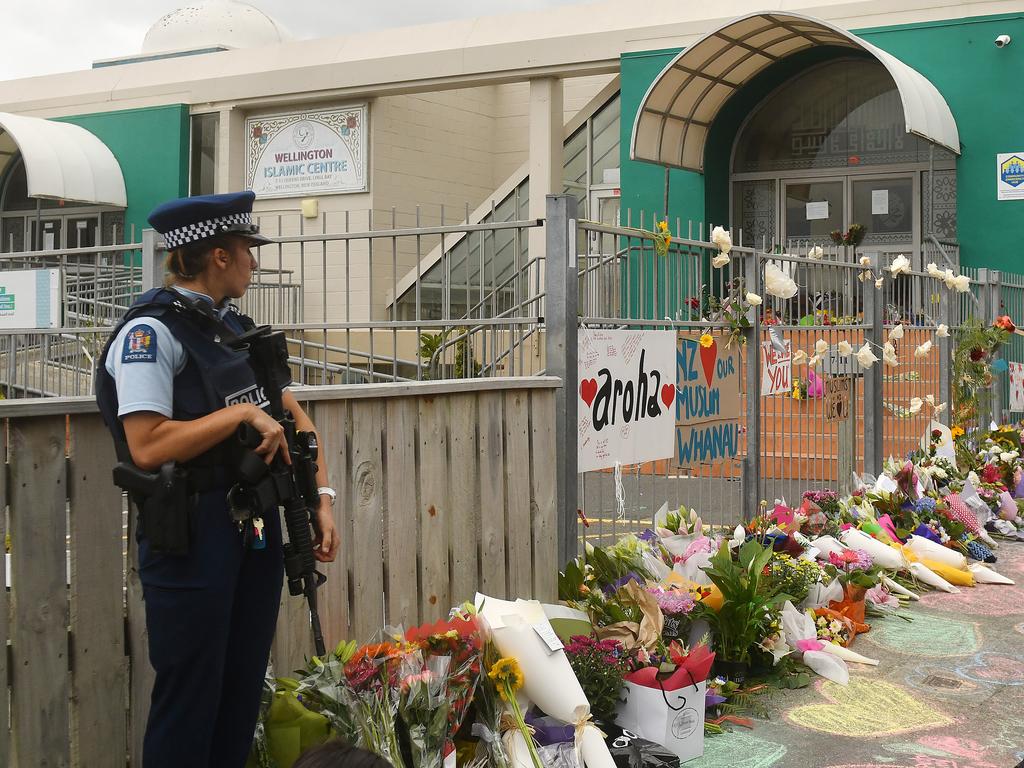 An armed police officer stands guard at the Kilbirnie Mosque in Wellington. Picture: Getty Images