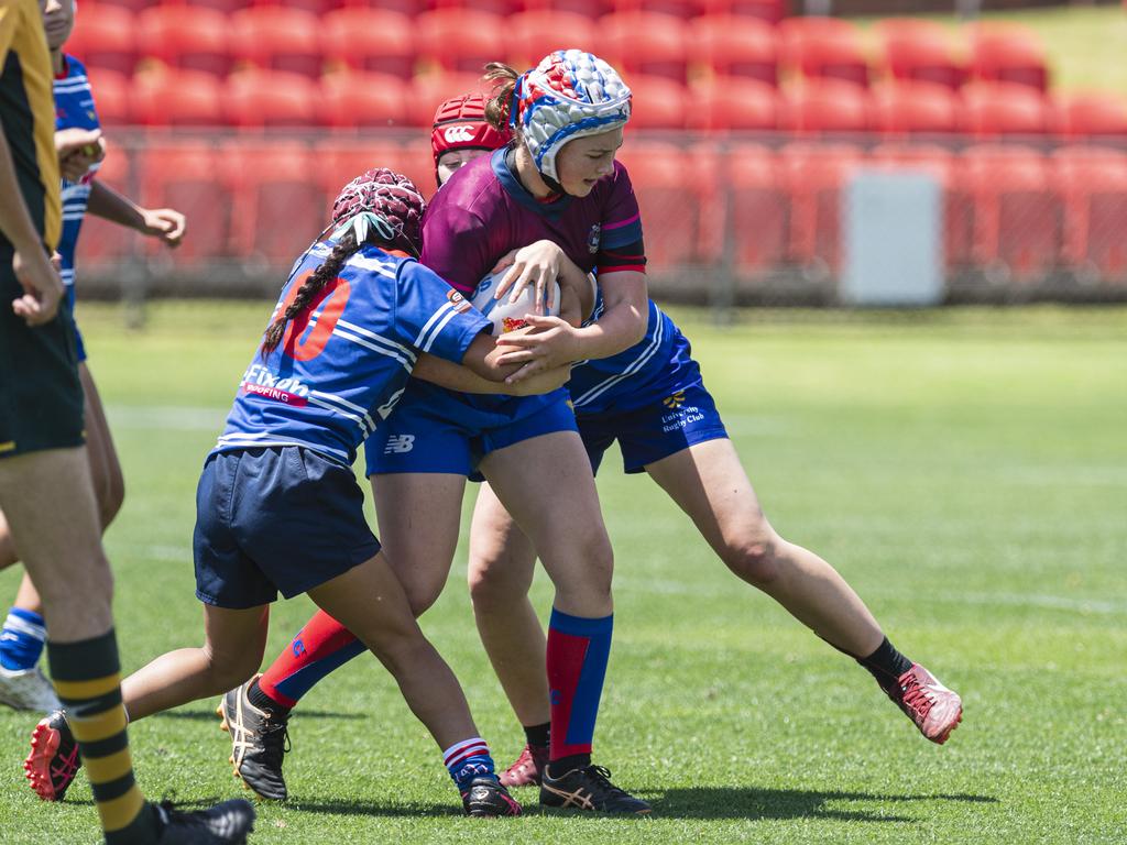 Lucy Warner of Bears keeps possession against University in a club game as Downs Rugby host Next Gen 7s at Toowoomba Sports Ground, Saturday, October 12, 2024. Picture: Kevin Farmer