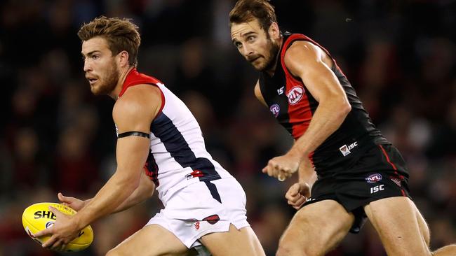 Back in form ... Melbourne gun Jack Viney breaks away from Essendon’s Jobe Watson. Picture: Adam Trafford (AFL Media/Getty Images)