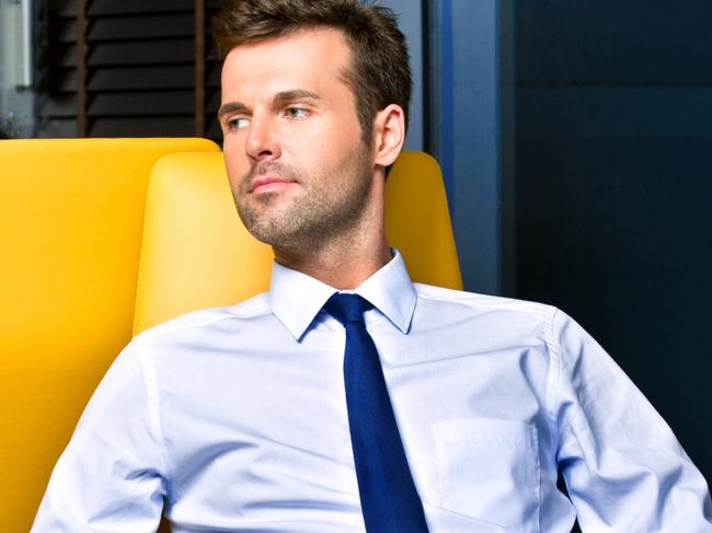 Businessman waiting for a flight at the airport vip lounge, resting comfortably in armchair. Picture: iStock.