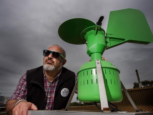 Professor Cenk Suphioglu is an expert in "thunderstorm asthma". Cenk with the Burkard Volumetric Pollen Sampler on the roof at Deakin. Picture Jay Town.