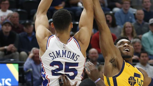 Philadelphia 76ers guard Ben Simmons is fouled hard by Donovan Mitchell. Picture: AP/Rick Bowmer