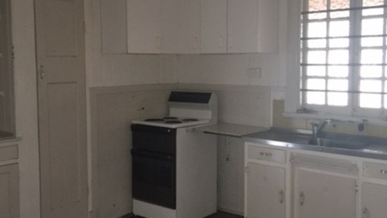 BEFORE: The kitchen in the house at 57 Rose St, Wooloowin, before it was renovated.