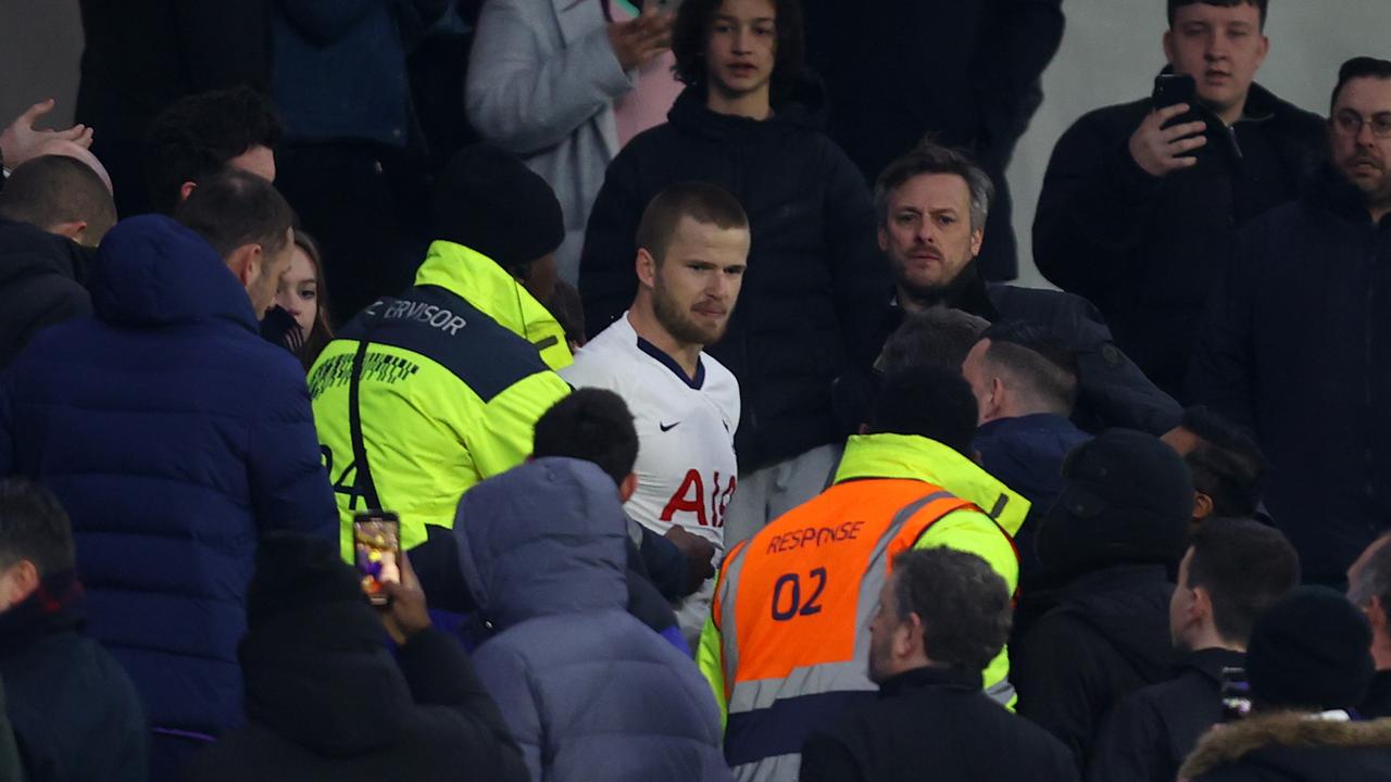 Eric Dier was led away by stewards after his foray into the crowd.