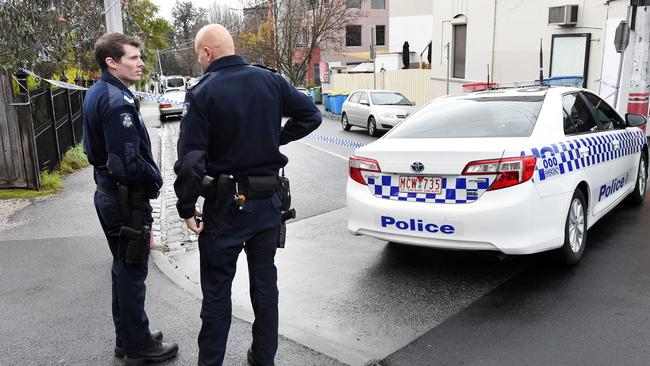 Police outside the Kew apartment where Elizabeth Wilms was found dead. Picture: Steve Tanner