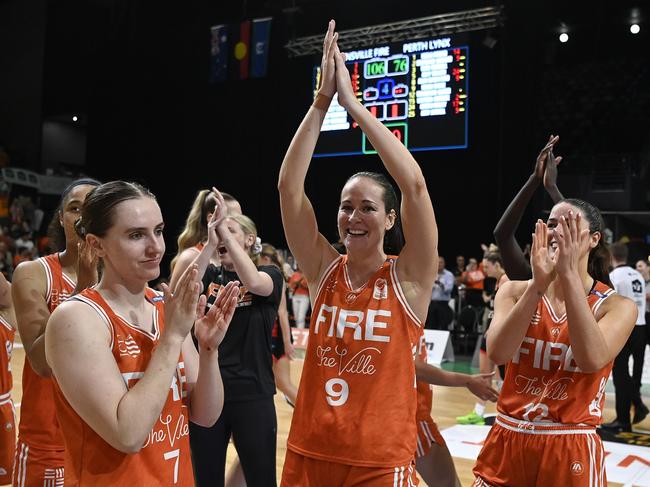 TOWNSVILLE, AUSTRALIA - FEBRUARY 26: The Fire celebrate after winning game two of the WNBL Semi Final series between Townsville Fire and Perth Lynx at Townsville Entertainment Centre, on February 26, 2025, in Townsville, Australia. (Photo by Ian Hitchcock/Getty Images)