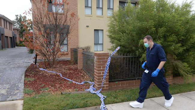 Forensics investigate the crime scene at the Ramona Ave townhouse the day after the alleged stabbing murder. Photo: Jeremy Piper