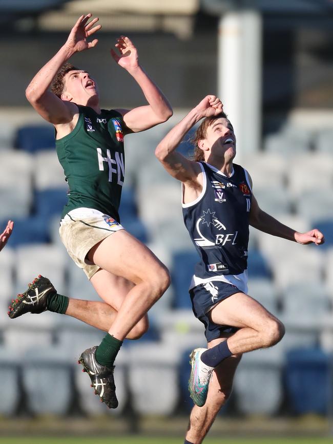 Hampden’s Jordan Fowler takes a mark over Ballarat’s Flynn Loader. Picture Yuri Kouzmin