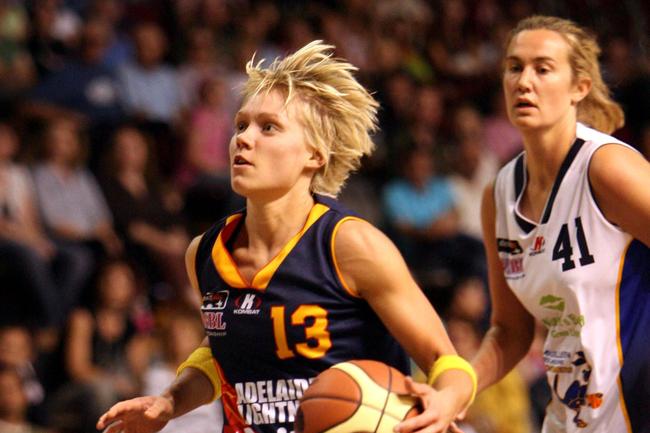 Erin Phillips cruises past Melbourne defender Anna Crosswhite during an Adelaide Lightning vs Bulleen Melbourne Boomers at Distinctive Homes Dome, Adelaide.