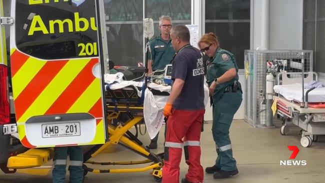 The woman is put into the ambulance. Picture: 7 NEWS