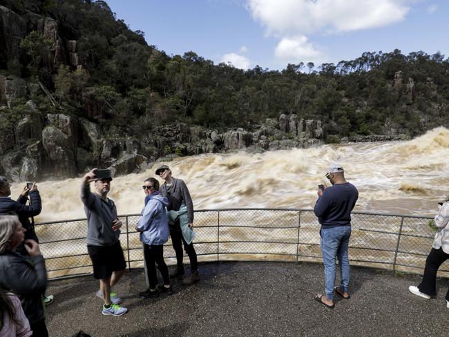 People come to see the floodwaters flow through the Cataract Gorge in Launceston. Sunday October 16th 2022. Picture: Grant Viney