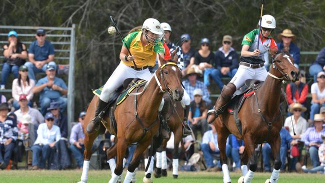 Lucy Grills (left) of Holbrook, NSW with ball for Australia in the World Cup polocrosse.