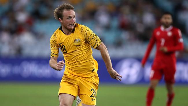 Grant and his mullet bursting down the right for the Socceroos. Picture: Getty Images