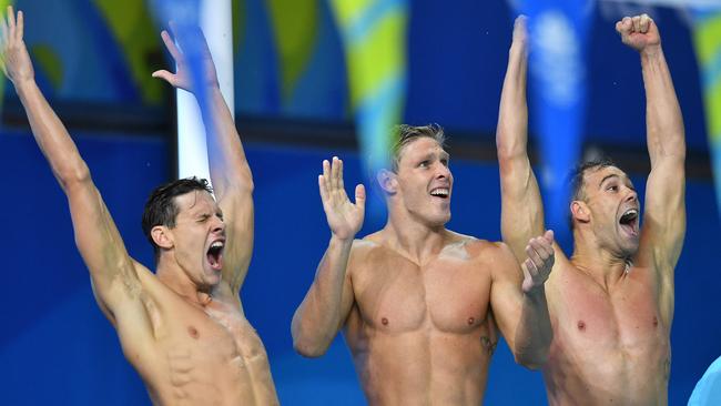 Mitch Larkin, Jake Packard and Grant Irvine celebrate their 4x100m medley relay win. Picture: AAP Image/Darren England