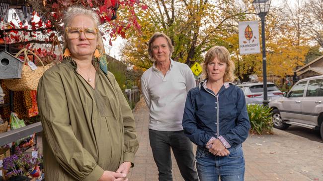 Storison shop owner Carolyn Cattrall with River Rd resident Robert Stewart and Dr Anne Fordham in Hahndorf’s main street. Picture: Ben Clark