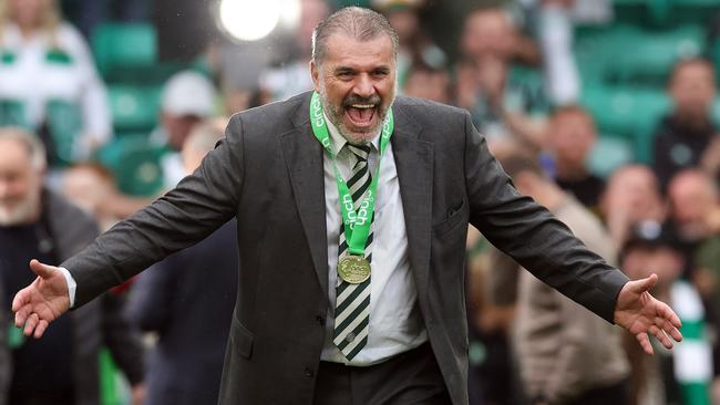 Ange Postecoglou celebrates his third trophy this season. Photo by Ian MacNicol/Getty Images.