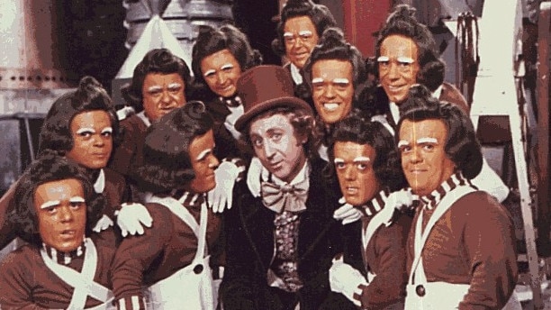 Willy Wonka and the Oompa Loompas from film 'Charlie and The Chocolate Factory'.