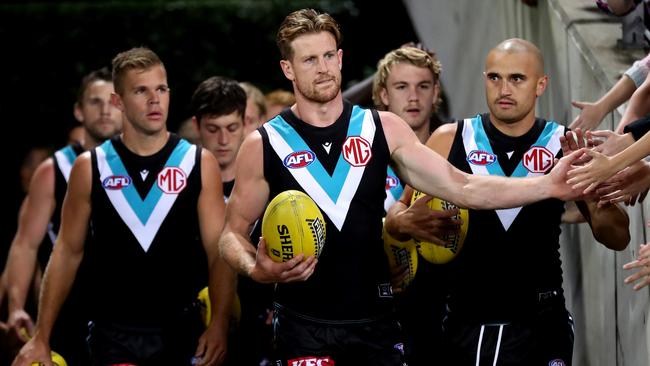 Jonas leading out the Power earlier this season. (Photo by Brendon Thorne/AFL Photos/via Getty Images )