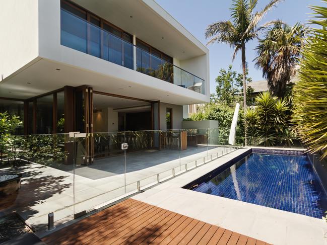 Brisbane News - Inside Outside Design.Rear garden of a contemporary Australian home with tiled swimming pool