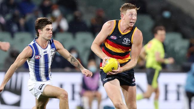 Kieran Strachan in action against the Kangaroos in Round 23. Picture: Sarah Reed/AFL Photos