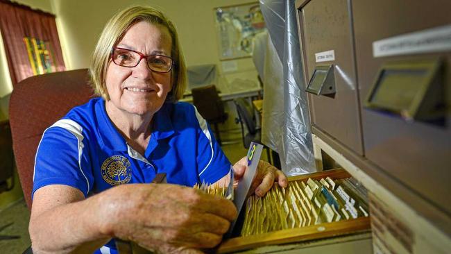 Paulette Flint searches through the draws of microfiche at the Gladstone Genealogical Society. Picture: Matt Taylor GLA190818GENE