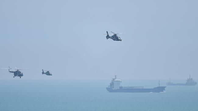 Chinese military helicopters fly past Pingtan island. Picture: AFP