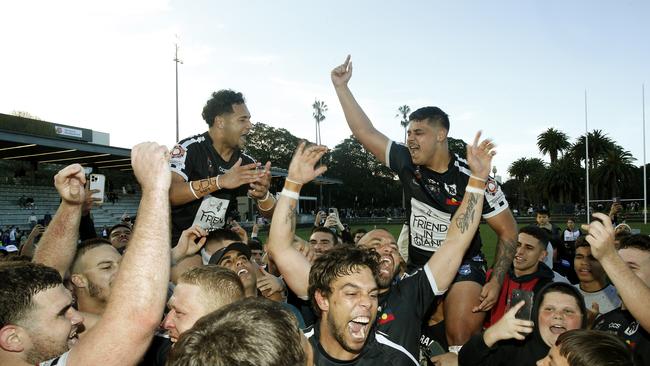 Redfern All Blacks A-Grade go wild after the win. Picture: John Appleyard