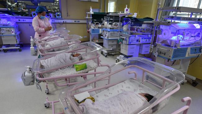 A medic takes care of a newborn baby in the paediatric ward of a hospital in Fuyang in China's eastern Anhui province. Picture: AFP