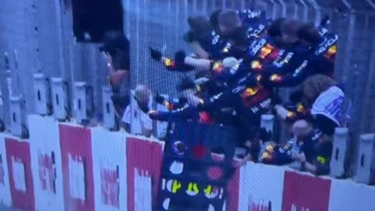 Images of the Red Bull personnel celebrating in pitlane