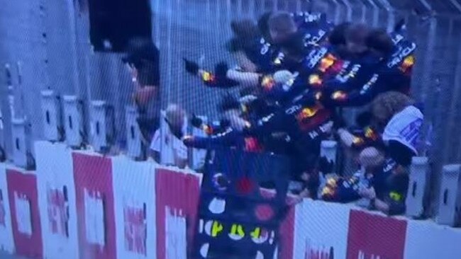 Images of the Red Bull personnel celebrating in pitlane