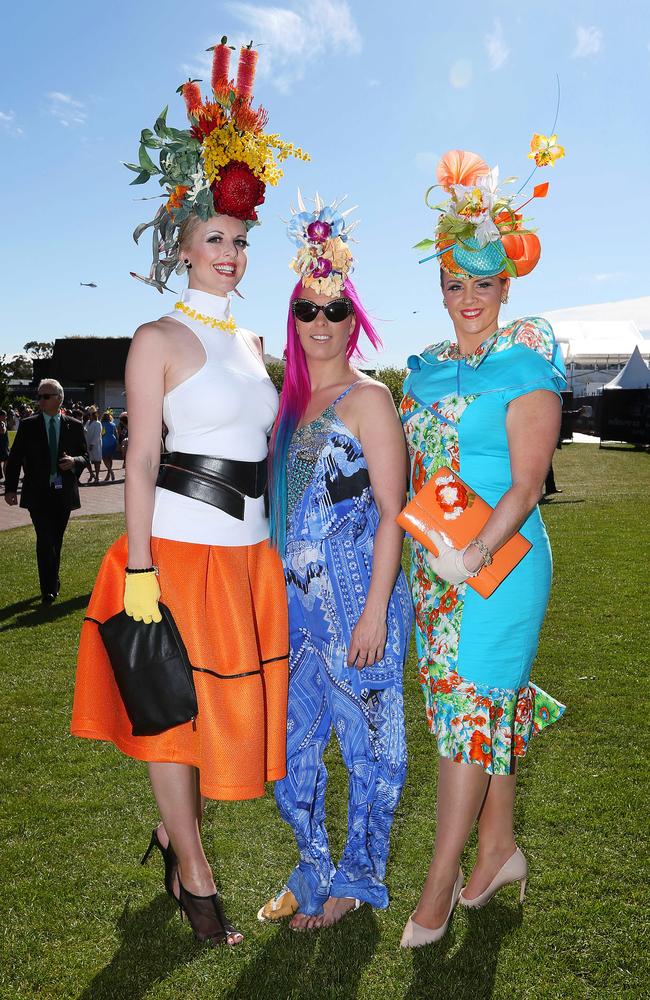 Colourful headwear is the order of the day for Leeanne Symes, Pegi Lea and Cassandra Ambrose at the 2014 Melbourne Cup. Picture: Mark Stewart