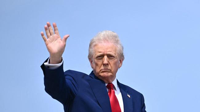 US President Donald Trump waves as he boards Air Force One at Joint Base Andrews in Maryland. Picture: AFP