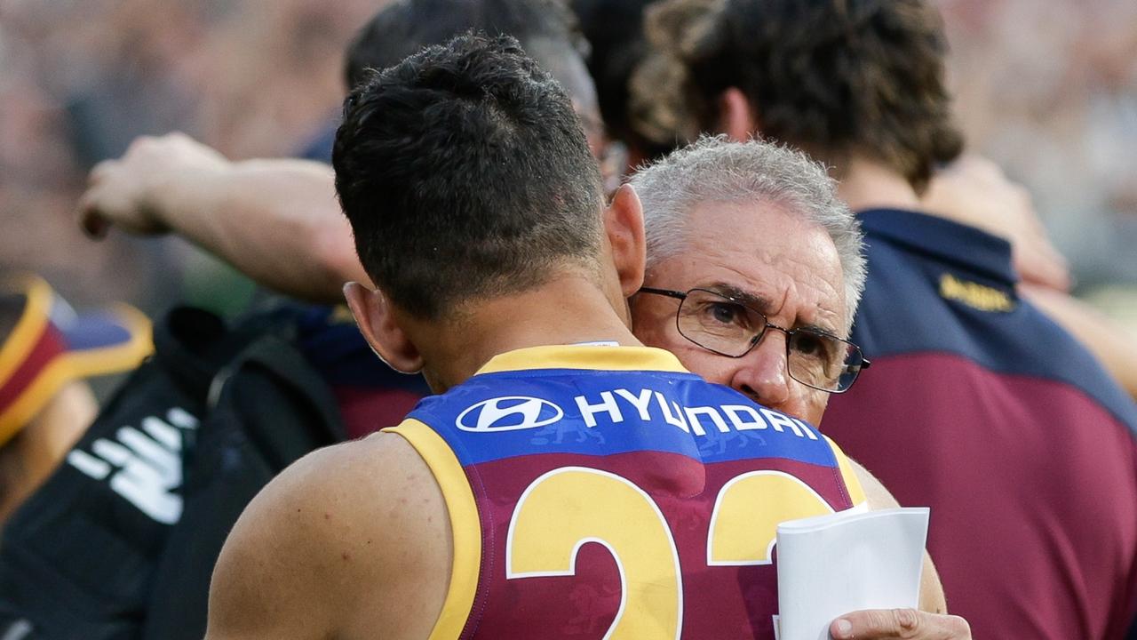 Chris Fagan embraces Charlie Cameron after the loss. (Photo by Russell Freeman/AFL Photos via Getty Images)