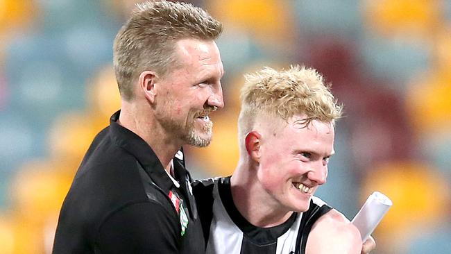 Nathan Buckley savours a Collingwood win with John Noble.