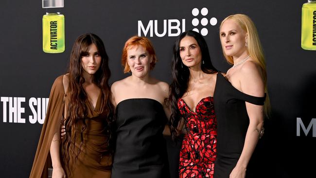 Tallulah Willis, second from left, with her sisters and mother, Demi Moore, was recently diagnosed with autism. Picture: Jon Kopaloff/Getty Images)