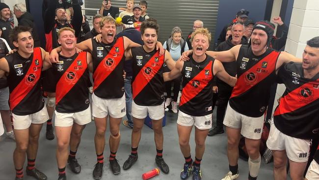 The Frankston Bombers sing the song after their one-point win over Langwarrin on Saturday. Picture: Facebook