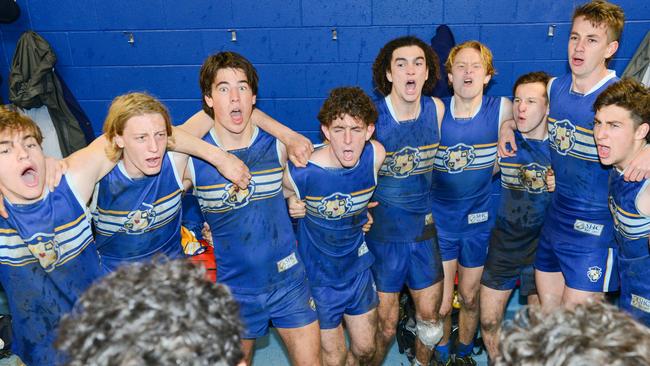 Sacred Heart players sing the team song after beating Rostrevor in the intercol on Saturday. Picture: AAP/Brenton Edwards